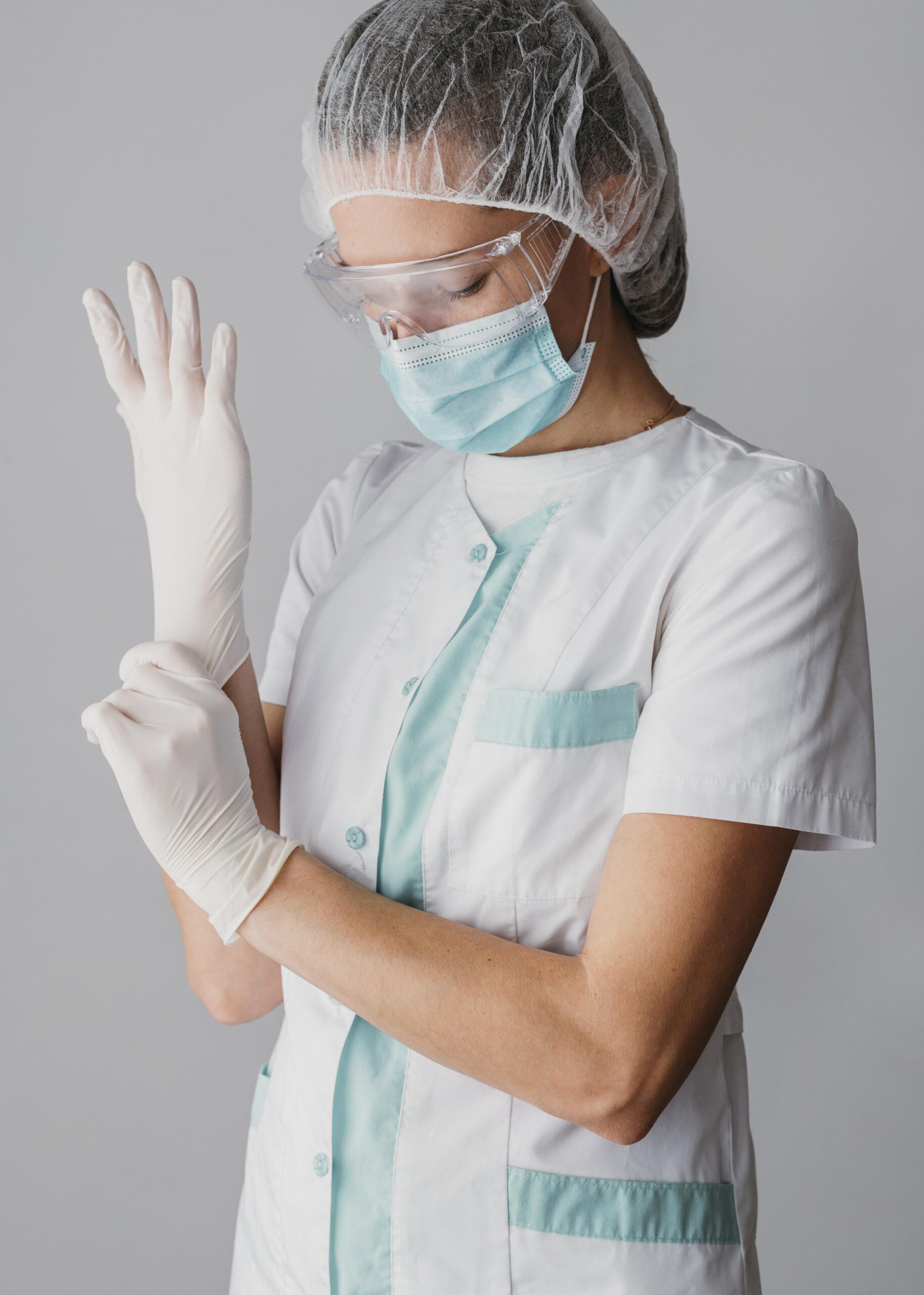 doctor-putting-surgical-gloves